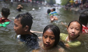 Children swim in a moat during the Songkran water festival in Chiang Mai, Thailand.