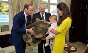 Catherine, the Duchess of Cambridge, holds her son Prince George as his father, Prince William , holds a giant toy wombat that was given as a present to him from Australia's Governor-General Peter Cosgrove.