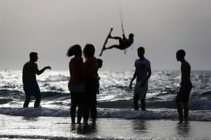 People play at the shore of the Mediterranean sea at the southern Israeli city of Ashkelon, during the vacation of the Jewish holiday of Passover.