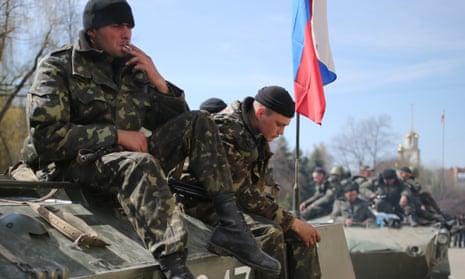 Militia personnel on a captured armoured military vehicle in the town of Slavyansk. ukraine