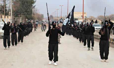 Fighters of al-Qaeda linked Islamic State of Iraq and the Levant parade at Syrian town of Tel Abyad