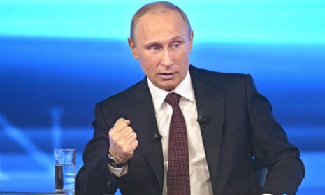 Vladimir Putin gestures while speaking during his annual call-in live broadcast in Moscow