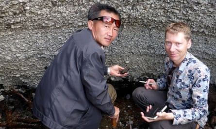 Clive Oppenheimer and Kim Ju Song investigating an outcrop of the Millennium Eruption Deposit at Mount Paektu, North Korea Photograph: Clive Oppenheimer