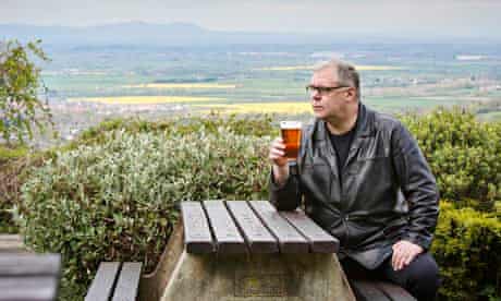 Kevin McKenna takes in the view from the Rising Sun pub at Cleeve Hill, Cheltenham, Gloucestershire.