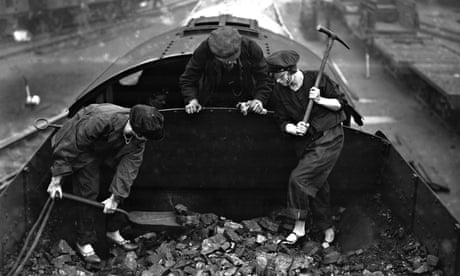 Men and women shovelling coal