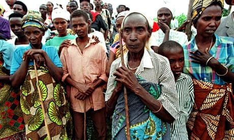 Genocide survivors listen to an address by Kofi Annan
