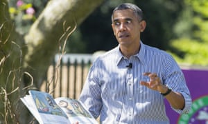 US President Barack Obama reads the book, "Where the Wild Things Are," to children attending the annual White House Easter Egg Roll 