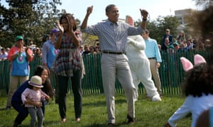 President Barack Obama and first lady Michelle Obama cheer children as they participate in the annual White House Easter Egg Roll o