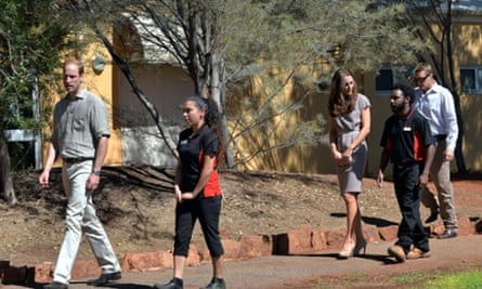 Britain's Prince William (L) and his wife Catherine (3rd R), the Duchess of Cambridge, arrive to distribute certificates to the graduating students at the National Indigenous Training Academy in Uluru.
