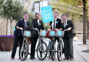 ActionAid campaigners on Barclays Cycle Hire "Boris Bikes"  wear masks featuring the face Antony Jenkins.