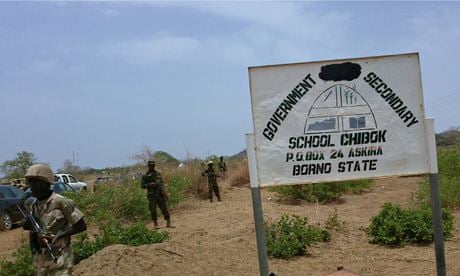 Soldiers guard a government secondary school in Chibok, Nigeria, where gunmen abducted 234 girls
