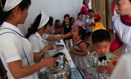 North Korean nurses give Vitamin A supplements and deworming pills to children dressed in their best outfits at an elite nursery school in Pyongyang. UNICEF and North Korean government agencies are collaborated in the campaign to assist 1.7m children under the age of five.