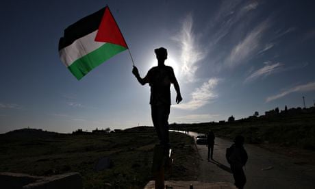 A boy holds a Palestinian flag in the village of Nabi Saleh, west of Ramallah.