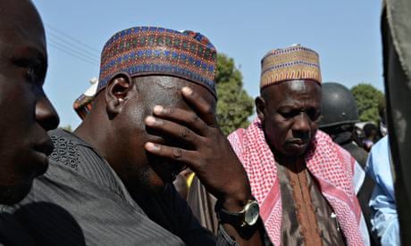 A father weeps as he joins other parents of the kidnapped schoolgirls in Chibok.