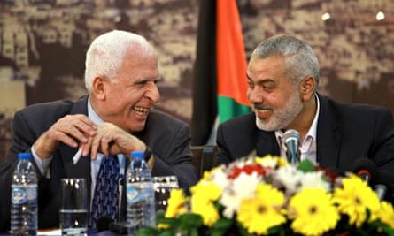 Senior Fatah official Azzam Al-Ahmed (l) with head of Hamas, Ismail Haniyeh