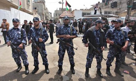 Palestinian security forces stand guard in Gaza City