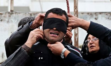 Samereh Alinejad and her husband Abdolghani remove the noose from Balal.