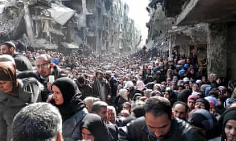 Residents of the besieged Palestinian camp of Yarmouk, in Damascus, Syria
