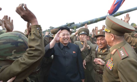 The North Korean leader, Kim Jong-un, meeting  soldiers of a long-range artillery unit in an undated photograph released as the regime announced live firing drills.