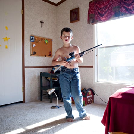 Benjamin, aged 7, from Louisiana, with his rifle, photo by An-Sofie Kesteleyn