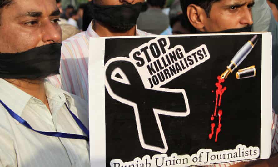 Pakistani journalists hold a placard during a protest against the killing of journalist Syed Saleem Shahzad, in Lahore, in 2011.