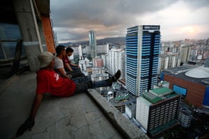 Tower of David: Men rest after salvaging metal on the 30th floor 
