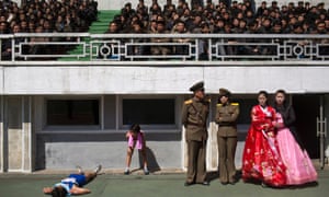 Runners rest inside Kim Il Sung Stadium in Pyongyang as North Korea hosts the 26th Mangyongdae Prize Marathon, April 2013, to mark the birthday of the late leader Kim Il Sung. North Korea is opening up the streets of its capital to runner-tourists for the annual Pyongyang marathon on April 13 2014