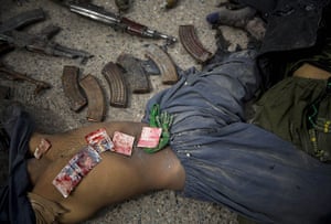 20 Photos: Bank notes covered in blood on the body of a dead suicide bomber, Kandahar