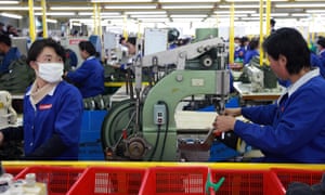 North Korean employees work at the assembly line of the factory of South Korean company at the Kaesong industrial complex December 19, 2013