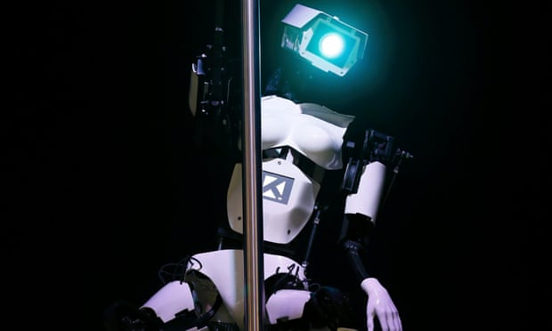 'Female' robot Tess wearing white stilletoes pole dances during a demonstration on the Tobit Software stand at the CeBIT trade fair in Hanover March 10, 2014