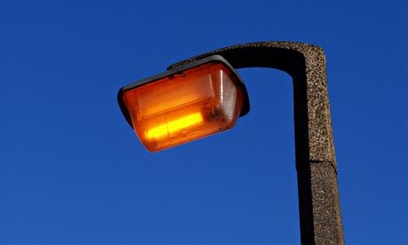 Street lamp against blue sky