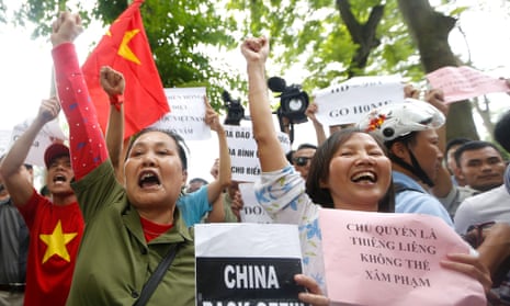 Protesters shout anti-China slogans outside the embassy.