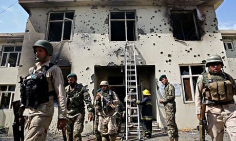 Afghan forces surround a justice ministry building in Jalalabad
