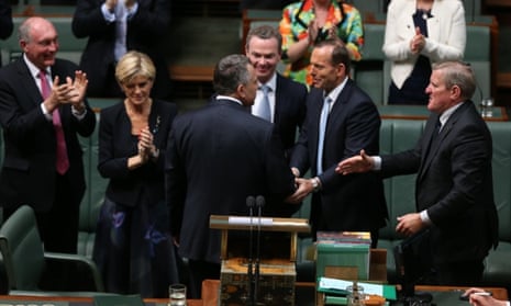 The Treasurer Joe Hockey is congratulated by his front bench colleagues after delivering his first budget in The House of Representatives tonight, Tuesday 13th May 2014.