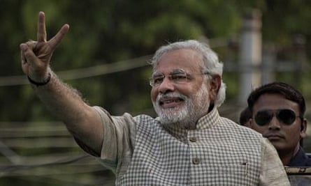 Narendra Modi makes a victory sign