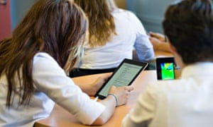 Schoolgirls using iPad