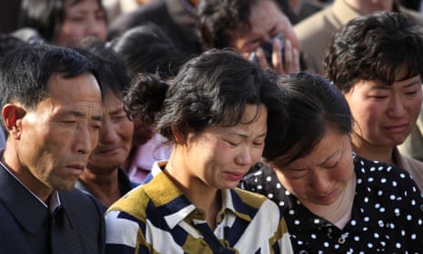 North Koreans grieve during a gathering in Pyongyang where senior officials apologised for a building collapse.
