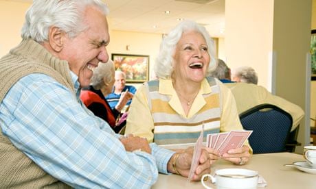 Two residents in a retirement home playing cards