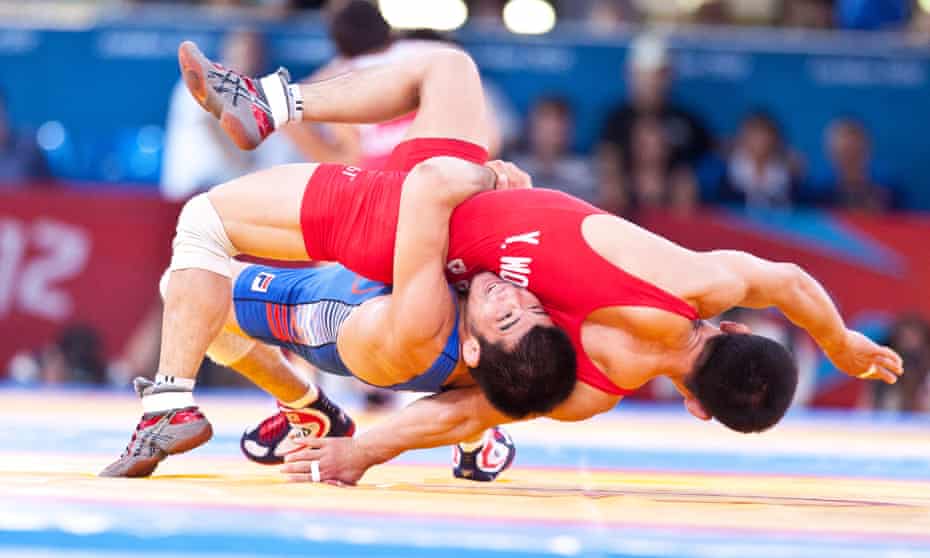 Yun Won-chol of North Korea wrestles with South Korea's Choi Gyujin.