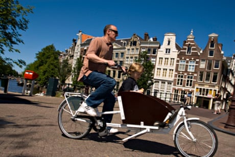 Take the kids up front in a cargo-tricycle, called a bakfiets.