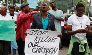 People attend a demonstration calling on government to rescue kidnapped school girls on 1 May, 2014.