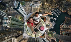 Nineteen-year-old Alexander Remnev scaled the Princess Tower - the worlds tallest residential building at 1,350ft - before getting his camera out to take this stomach-churning picture.