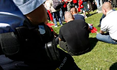 Police watch neo-Nazis during national holiday celebrations on Lake Lucerne's Rütli meadow, 
