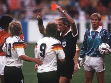 The referee dismisses Rudi Voeller.