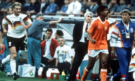 The post-phlegm moment as Rudi Voeller and Frank Rijkaard head towards the dressing room.
