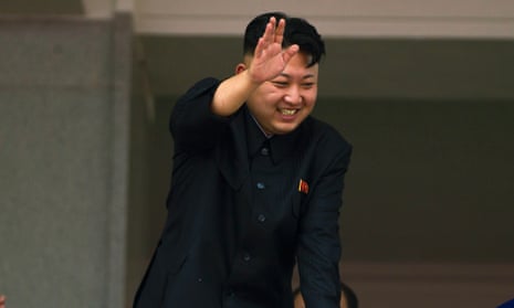 North Korean leader Kim Jong-un waves to Korean War veterans at a military parade in 2013.