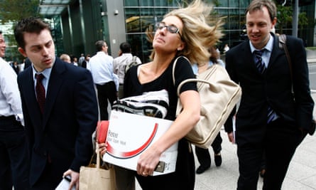 A worker carries a box as she walks away from the Canary Wharf office of the US investment bank Lehman Brothers on 15 September 2008, when the 158-year-old Wall Street firm sought bankruptcy protection.