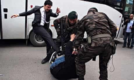 The image of Yusuf Yerkel kicking a protester that went viral