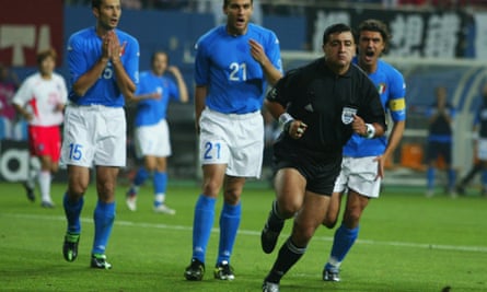 Italy’s players give chase to an inscrutable Byron Moreno, whose relationship with the country was only just beginning.