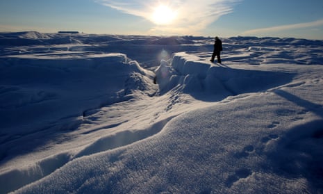 Scientist Ian Joughin of the University of Washington walks atop the glacier on July 15, 2013 on the Glacial Ice Sheet, Greenland.